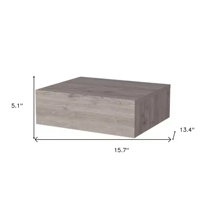 Comodino flottante con un cassetto in legno grigio
